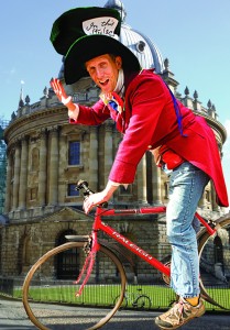 Mad hatter on bike by radcliffe camera image